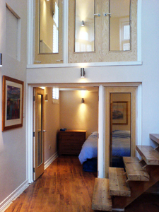 View of the staircase and second bedroom
